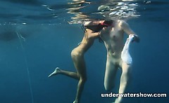 Nastya and Masha are swimming nude in the sea