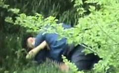 Hidden camera catches man and woman making out in the fores