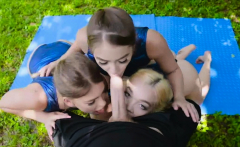 Three sexy gymnasts blowing cock outdoors