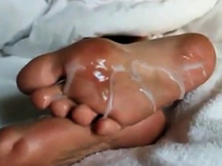 Huge load of cum over Mary's sexy feet soles!