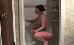 Hot milf cleaning the shower showing her ass