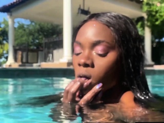 Naked ebony MILF fingers her hairy pussy