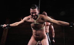 Greg takes a flogger to Vanders bound cock