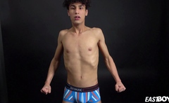 Curly twink boy shows off his slim body on webcam